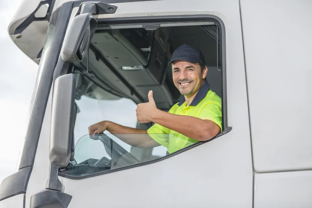 happy truck driver doing a thumbs-up