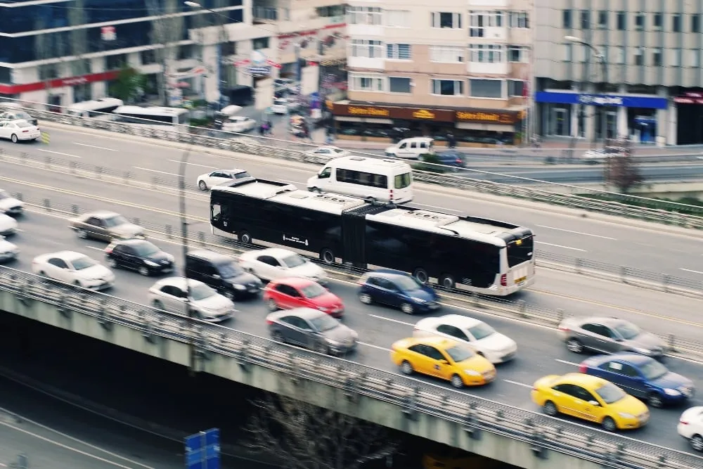 An elevated highway filled with daytime traffic.