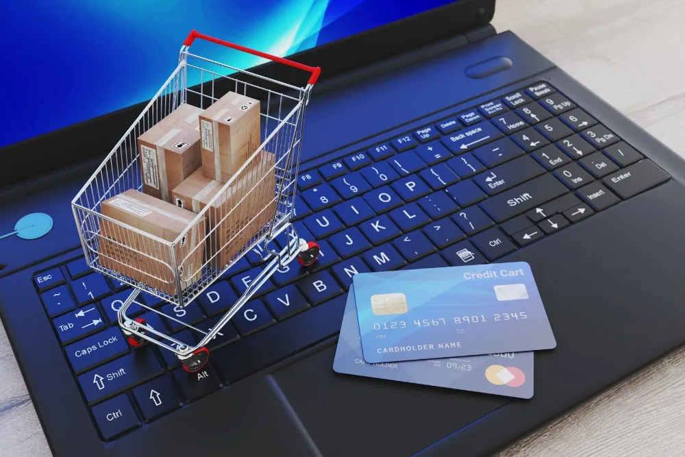 A laptop and a push cart miniature and card